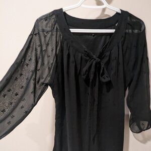 Sheer blouse with bow design